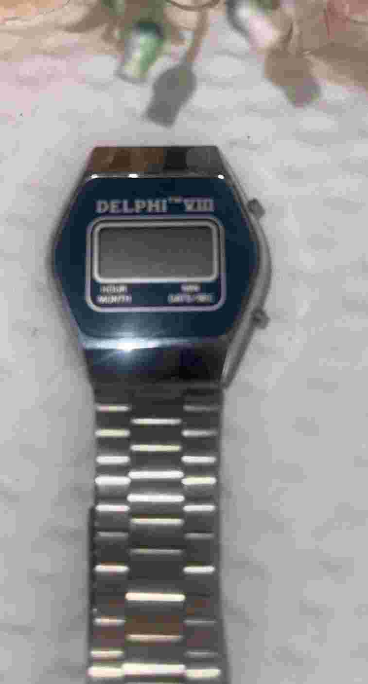 Vintage Delphi TM VIII Digital LCD Wrist Watch Silver Tone Womens Blue Face