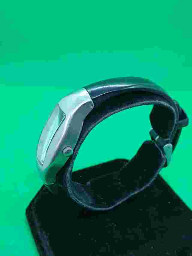 ladies roxy chrome watch,white & grey face,silver hands,black rubber strap.#32.