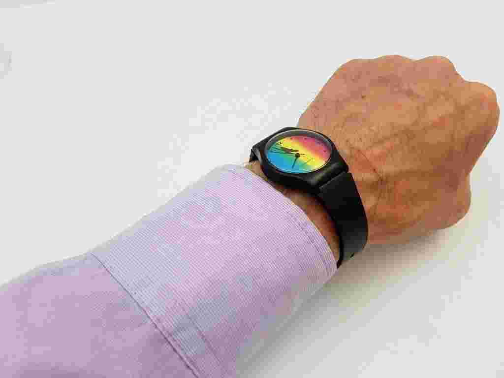 Beautiful lightweight plastic watch, quartz, eagle on a rainbow background.