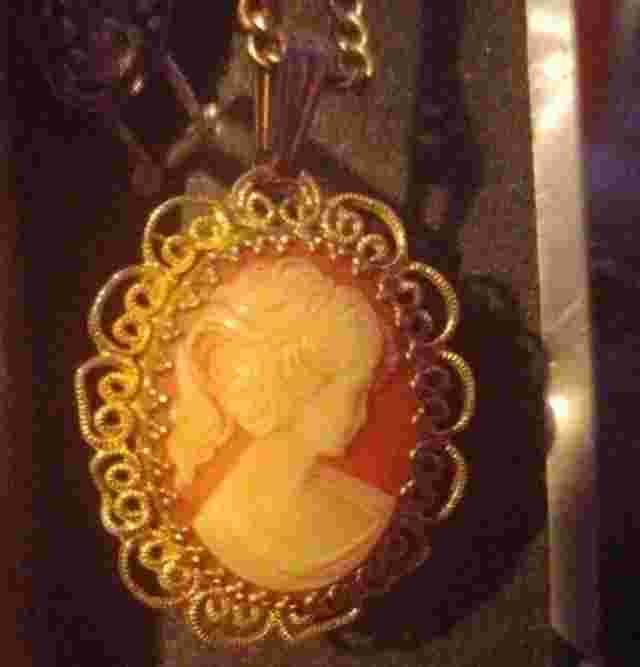Vintiage Jean cardot cameo pendent with wind up watch on reverse side. Rare