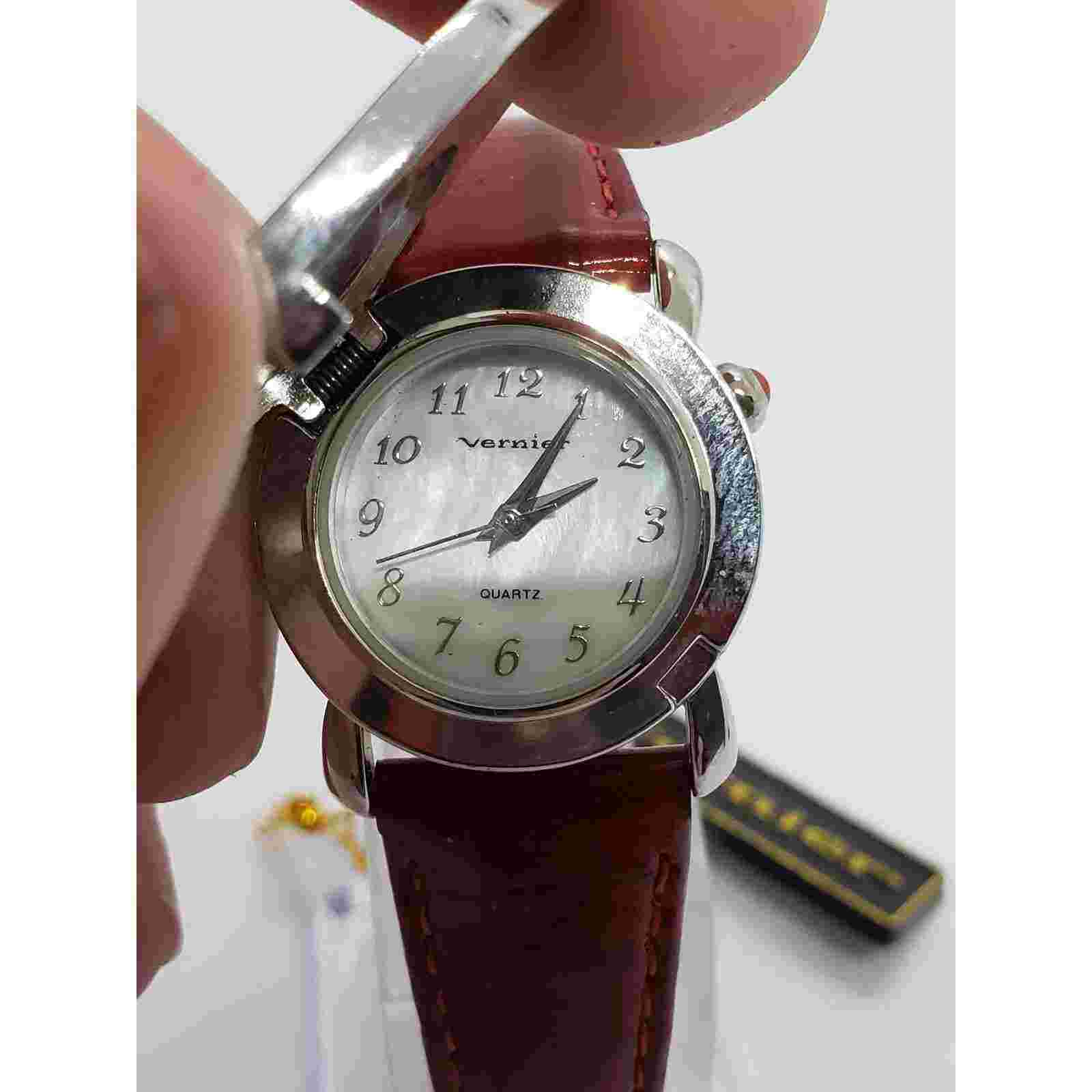 Vernier by 7 West. Red bonnet hat cover. Opalescent face. Working watch