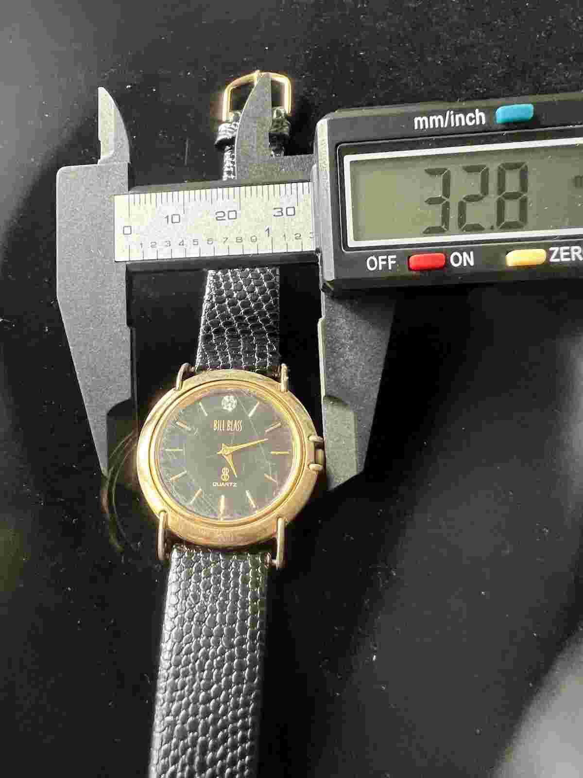 Vintage Bill Blass Gold Toned Stainless Steel Watch w/Black Leather Band