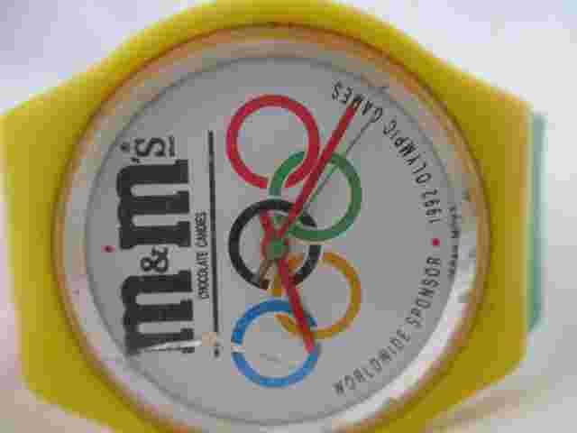 M&M's Analog Watch Red, Green, and Yellow Buckle Band Round White Face