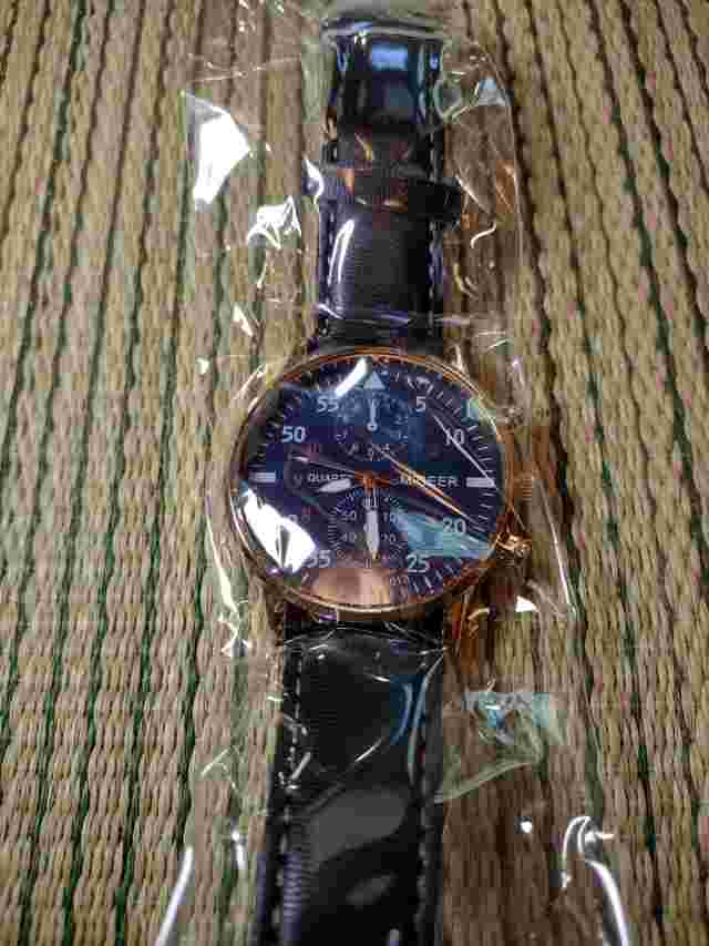 NOB Migeer Blue Dial Round Gold Tone Case Black Faux Leather Band Watch