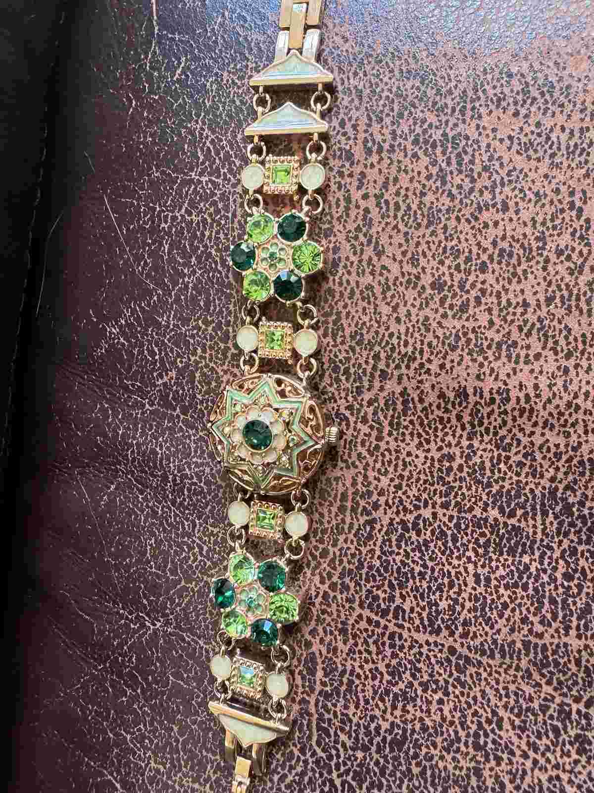 Colleen Lopes green rhinestone bracelet watch 7-1/2”. Plastic Still On Watch Z-5