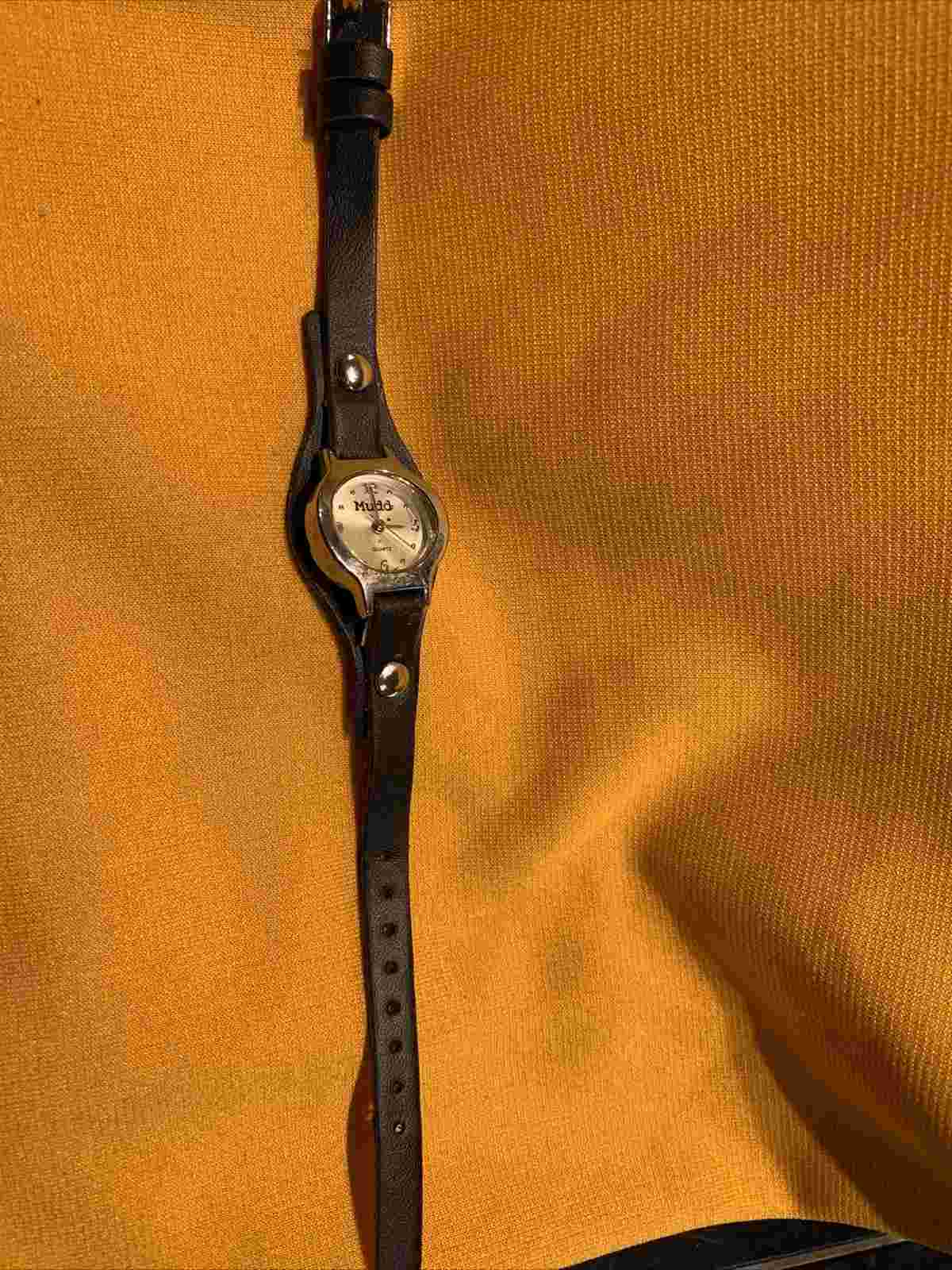 black band silver face mudd used womans watch quartz