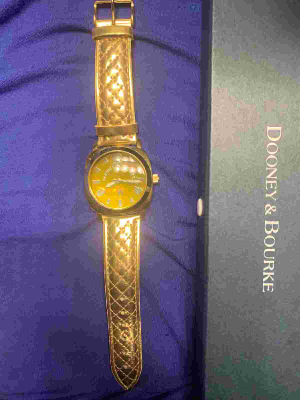 Dooney & Dooney and Bourke womans Vintage gold leather band watch. Never worn.