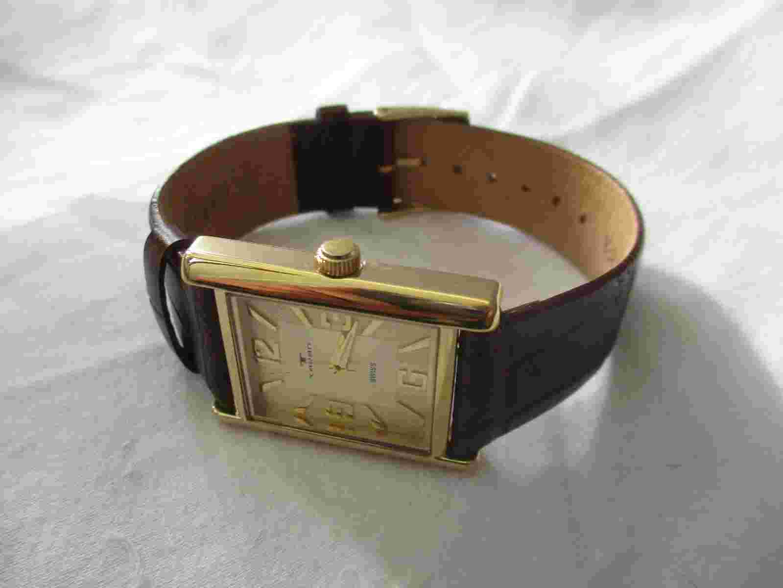 Swiss Tavan Analog Wristwatch with a Buckle Band and Water Resistance