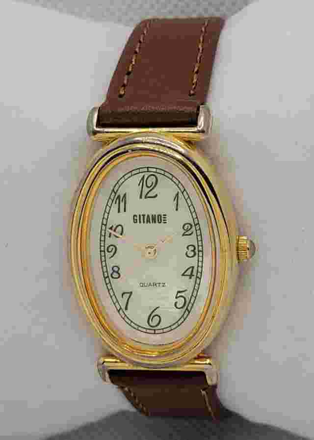 Ladies Gitano Oval Gold Tone Case White Dial Brown Leather Strap Watch L1