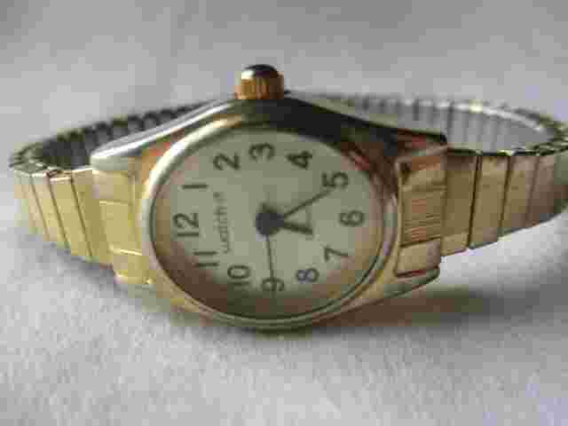 Watch It Analog Wristwatch Gold Tone Expansion Band Oval Shaped Face