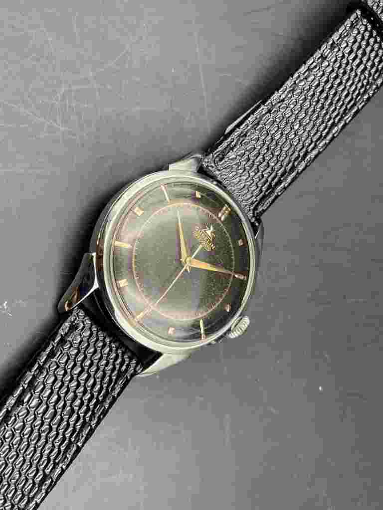1950s SS Gubelin Epso Matic with Tropical Black Gilt Dial.
