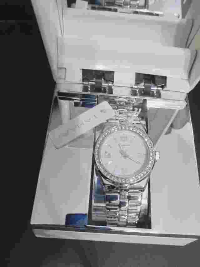 Tahari Wristwatch  Silver Stainless Steel Strap w/white mother of pearl dial-