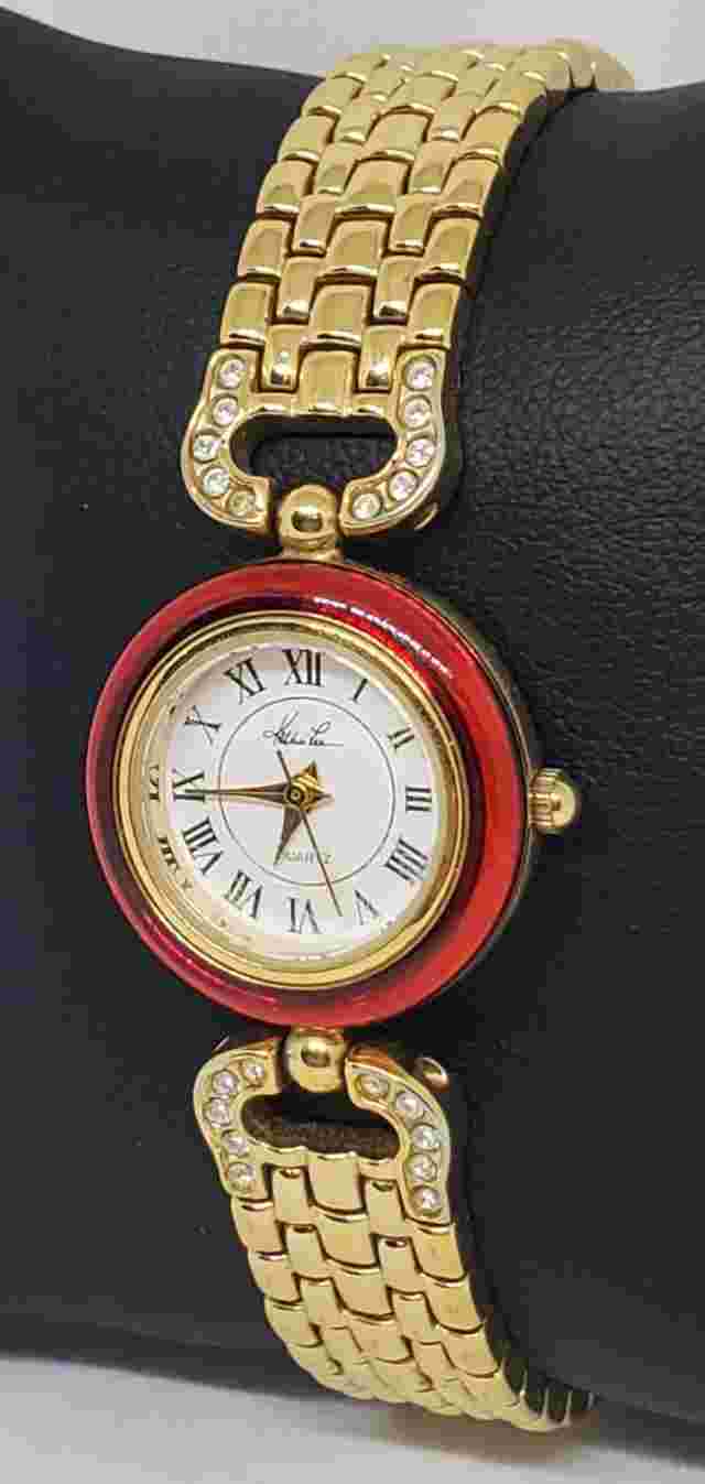 Ladies Kathie Lee Gold Tone Red Bezel White Dail Gemmed Link Bracelet Watch B3