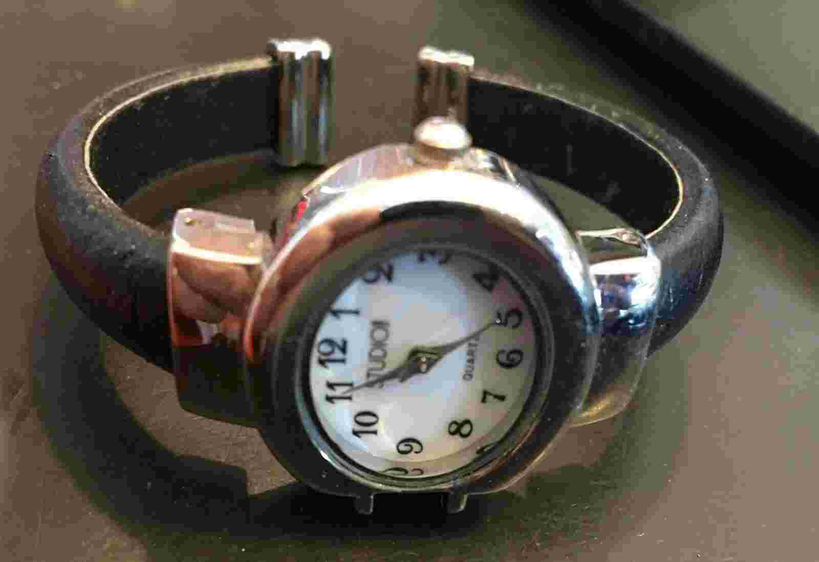 Woman's Studio Watch, Bracelet Style Silver Tone with Black leather Wrapped Brac