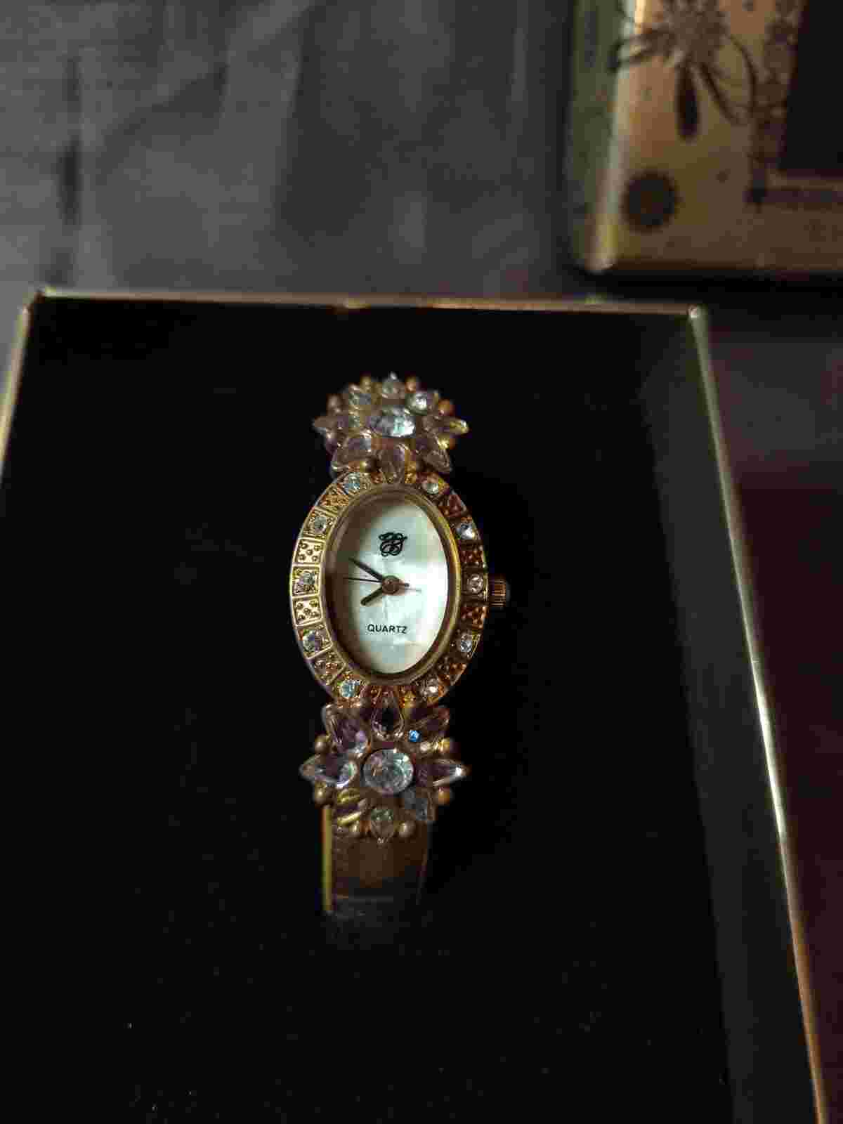 Elizabeth Taylor promotional gold tone, White Diamonds watch new in box.