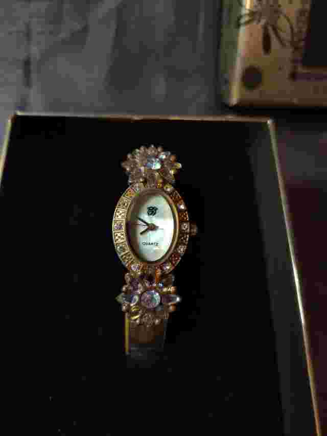 Elizabeth Taylor promotional gold tone, White Diamonds watch new in box.