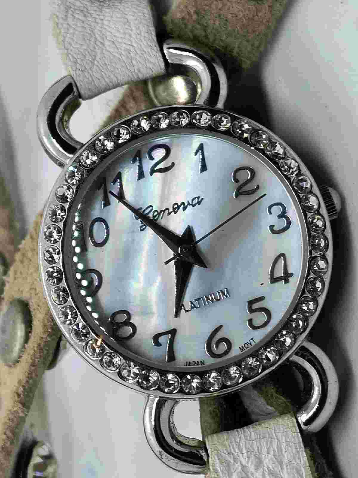 Geneva Platinum NO:9540 LC. White jeweled and studded wrap around band.