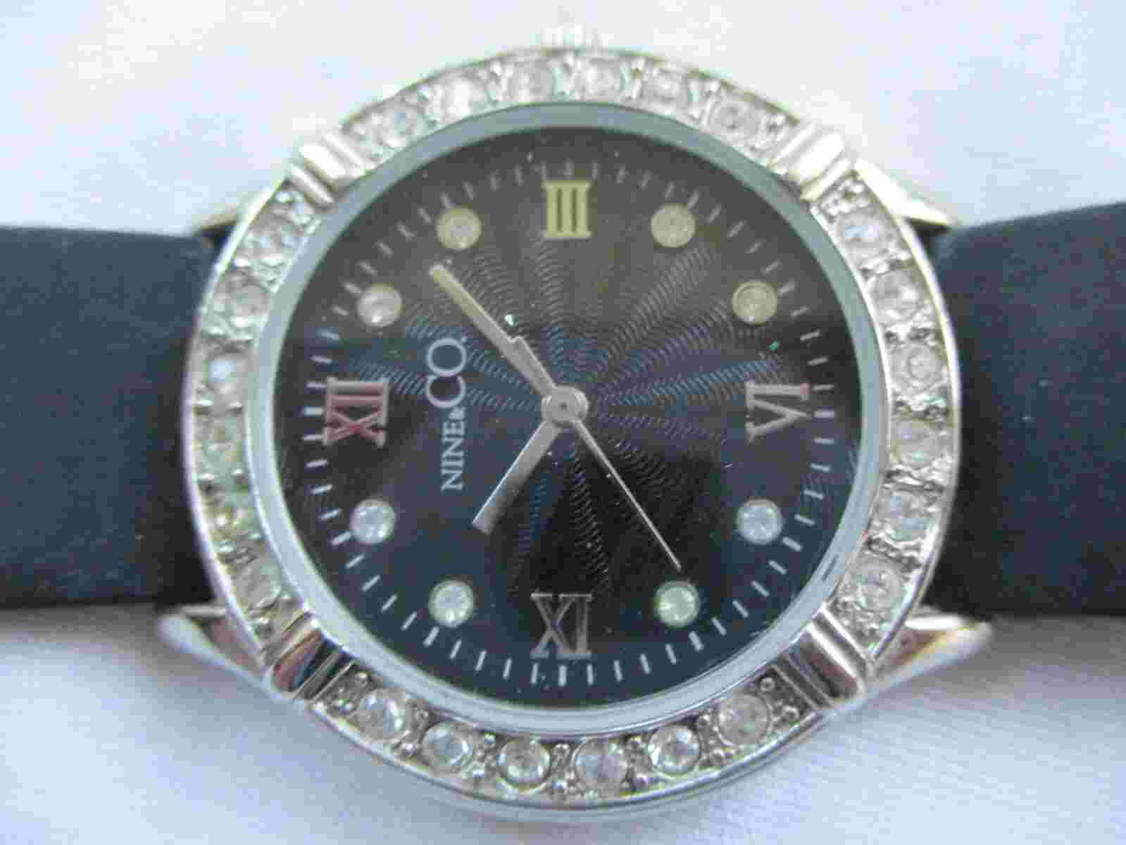 Nine & Co Analog Wristwatch with a Buckle Band