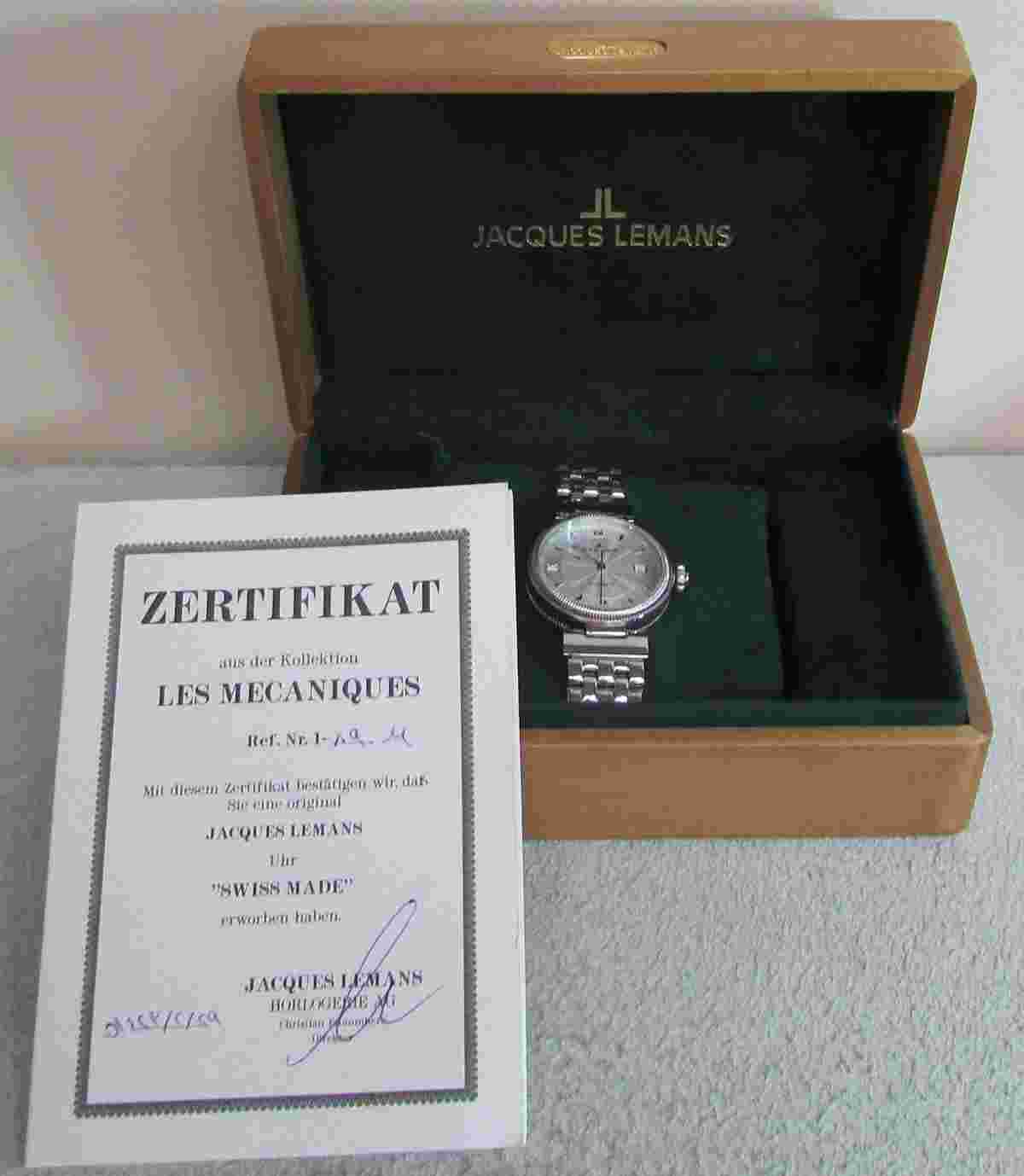 JACQUES LEMANS STAINLESS 1-890 AUTOMATIC SKELTON REVERSE DATE WATCH BOX & PAPERS
