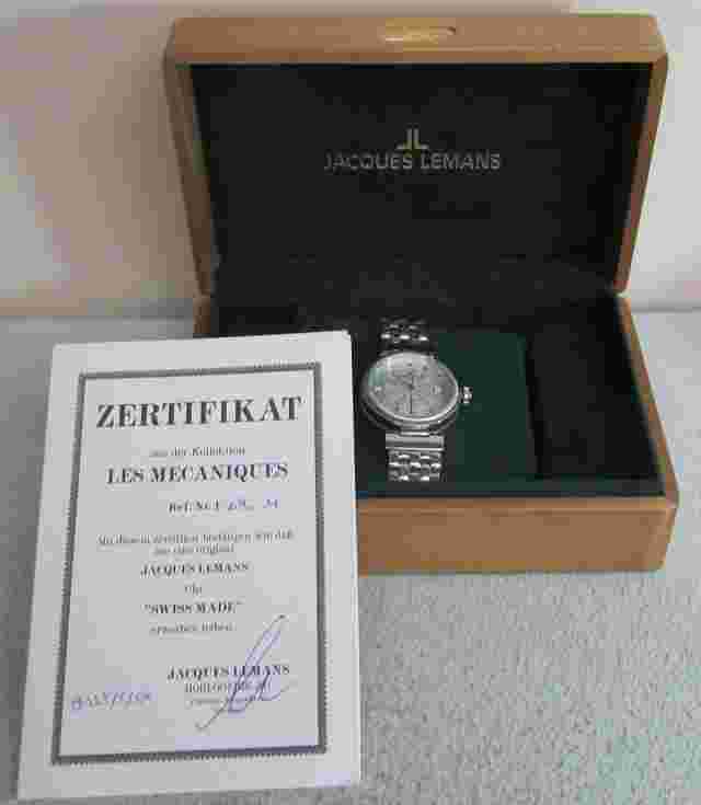 JACQUES LEMANS STAINLESS 1-890 AUTOMATIC SKELTON REVERSE DATE WATCH BOX & PAPERS