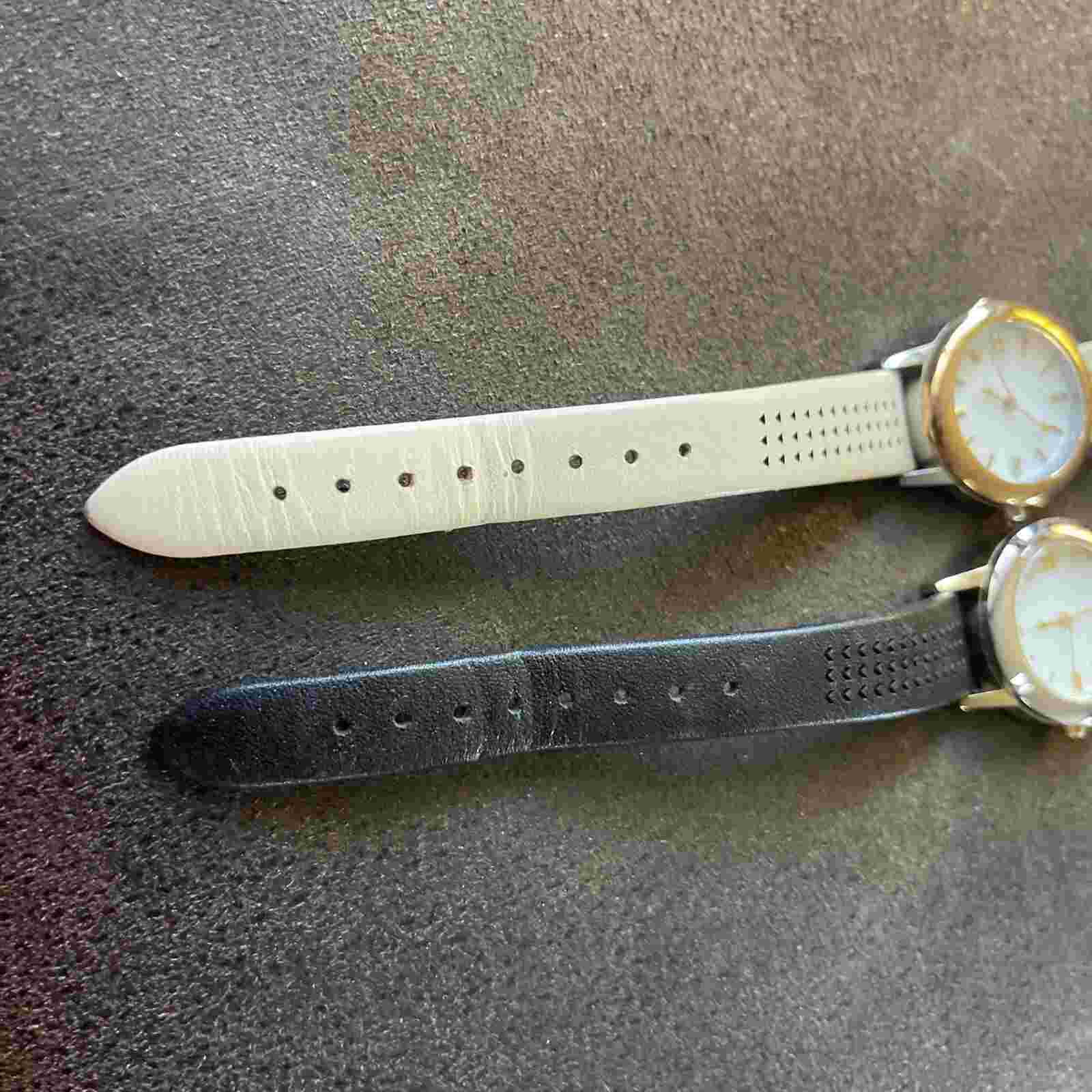Pair of ladies watches by Stella and dot beige and black leather strap  Stainles