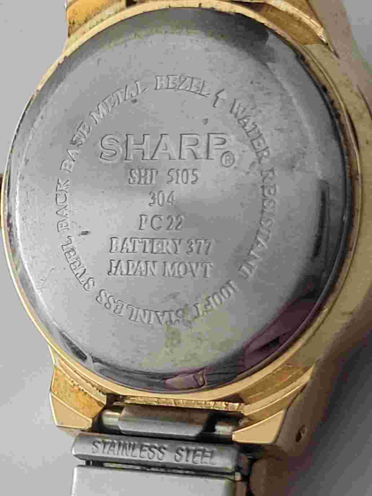 Sharp Quartz Watch. #SHP 5105 304 PC22. Battery Needed. Scratches. Sold As Is.