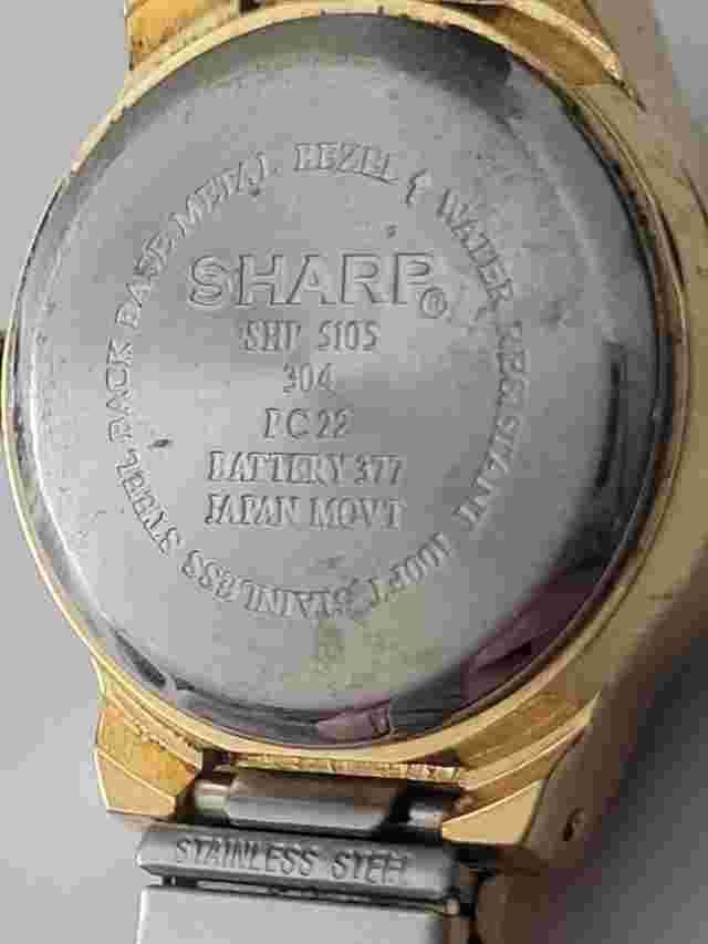 Sharp Quartz Watch. #SHP 5105 304 PC22. Battery Needed. Scratches. Sold As Is.