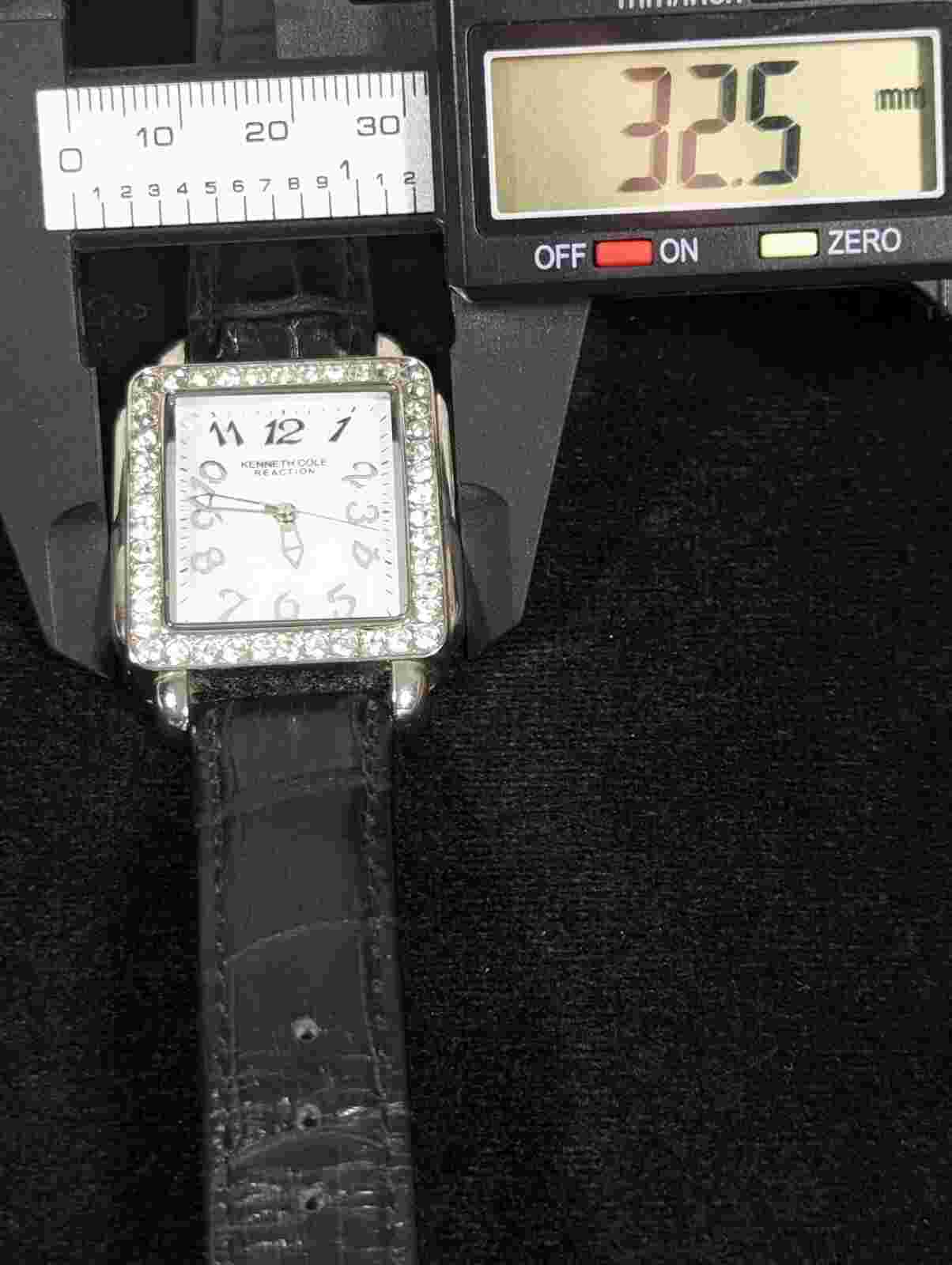 Kenneth Cole Reaction Crystal Accent Silver Tone Case Black Leather Band Watch