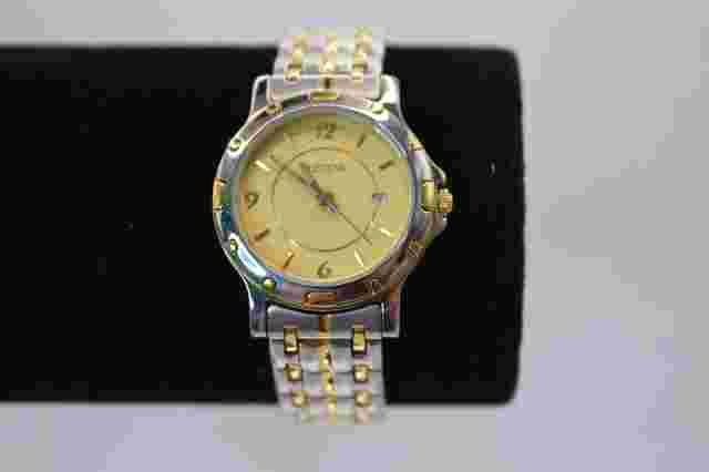 Jostens Ladies Swiss Wristwatch w/ Date Indicator Gold Silver Color SS Band
