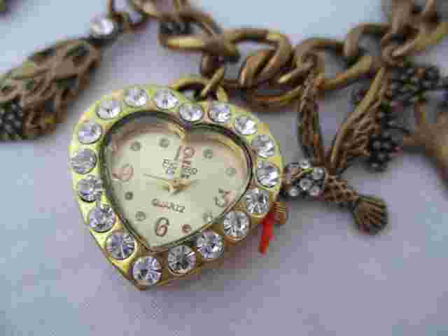 Figaro Couture Women's Gold Toned Charm Bracelet Band Analog Watch Forest