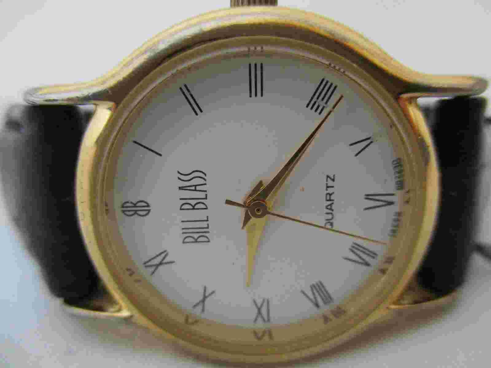 Bill Blass Analog Wristwatch Black Buckle Band Gold Tone Roman Numerals
