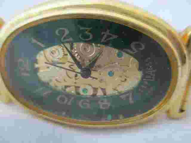 Express La Wristwatch Gold Tone Expansion Band Oval Shaped Face Gears