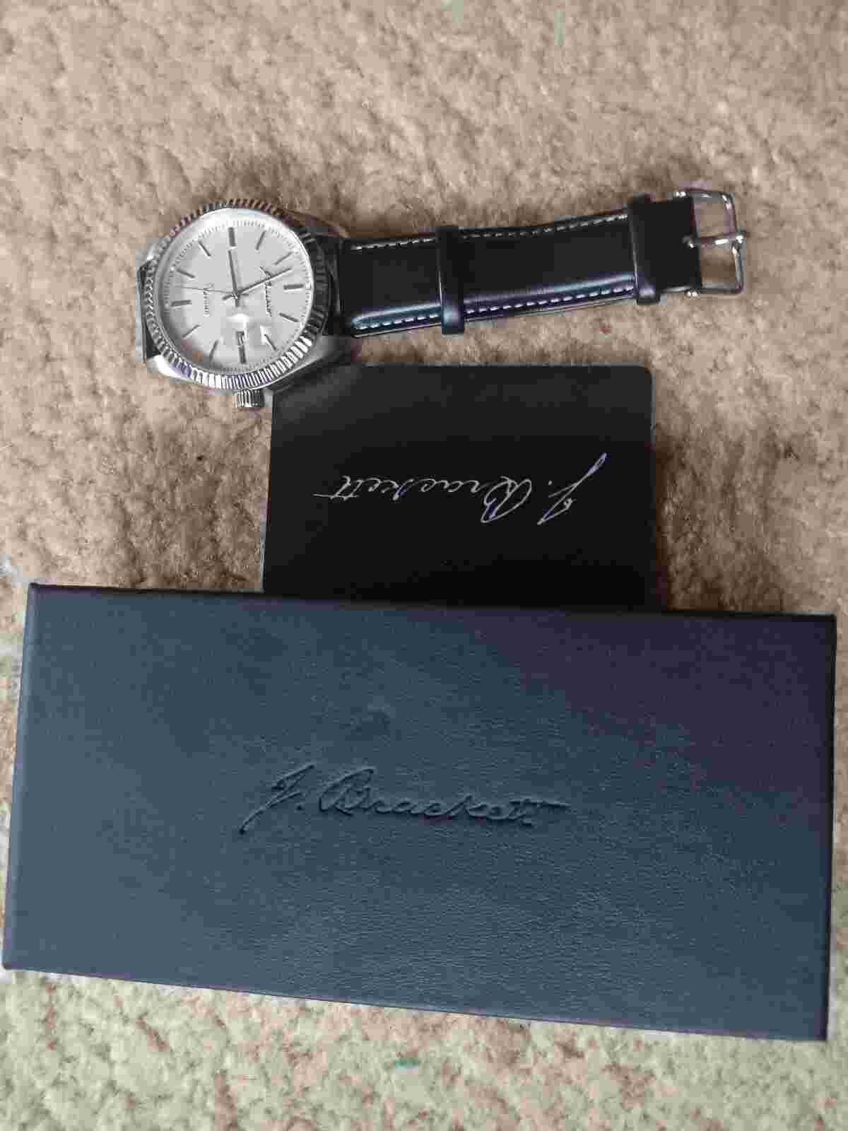 J. Brackett mens watch with a black leather band and chrome bezel. Classy watch