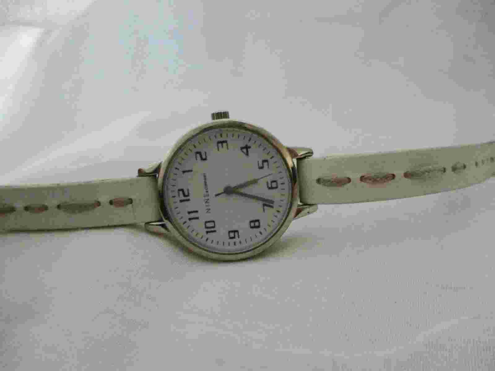 Nine & Company Analog Wristwatch with a Buckle Band