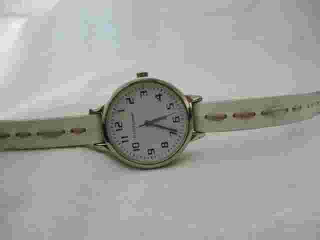 Nine & Company Analog Wristwatch with a Buckle Band