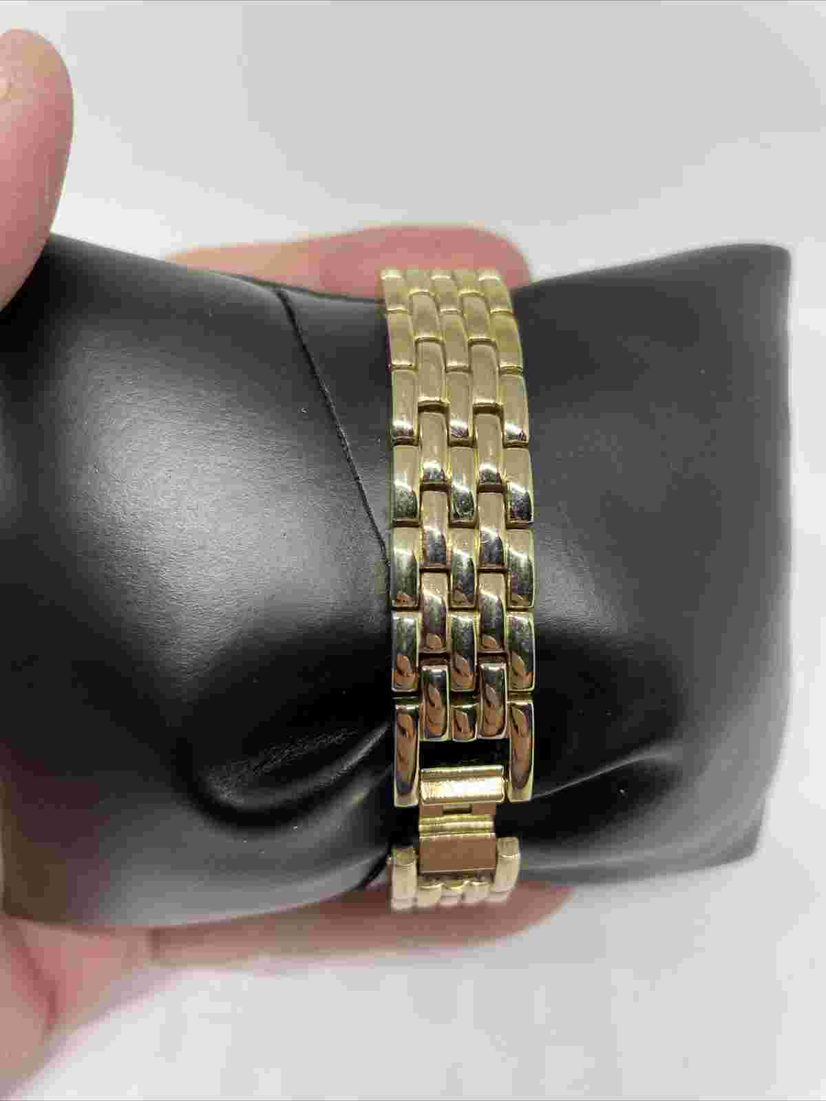 Vintage Luxe Ladies Black Face Goldtone Watch