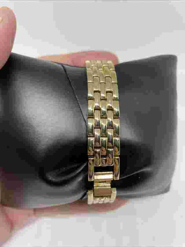 Vintage Luxe Ladies Black Face Goldtone Watch