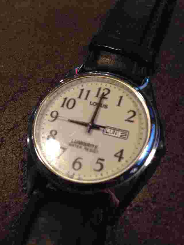 Vintage Lorus mens watch English & Spanish Day Of Week Japan Mvt Lumibrite Round