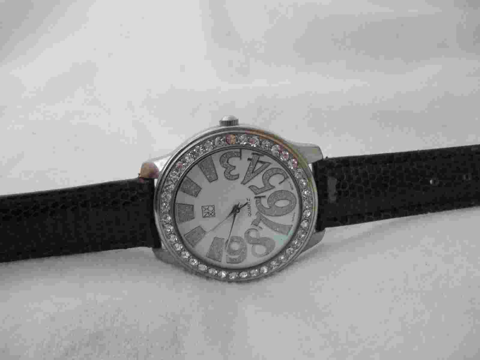 New York & Co Analog Wristwatch with a Buckle Band and Quartz Movement