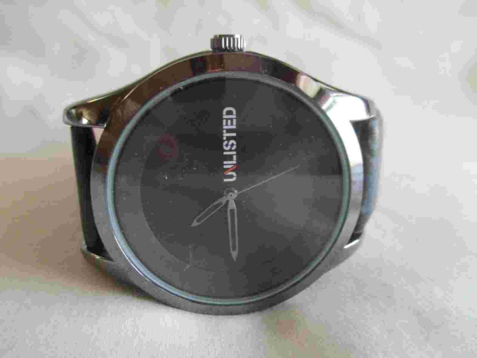 Unlisted Analog Wristwatch with a Buckle Band