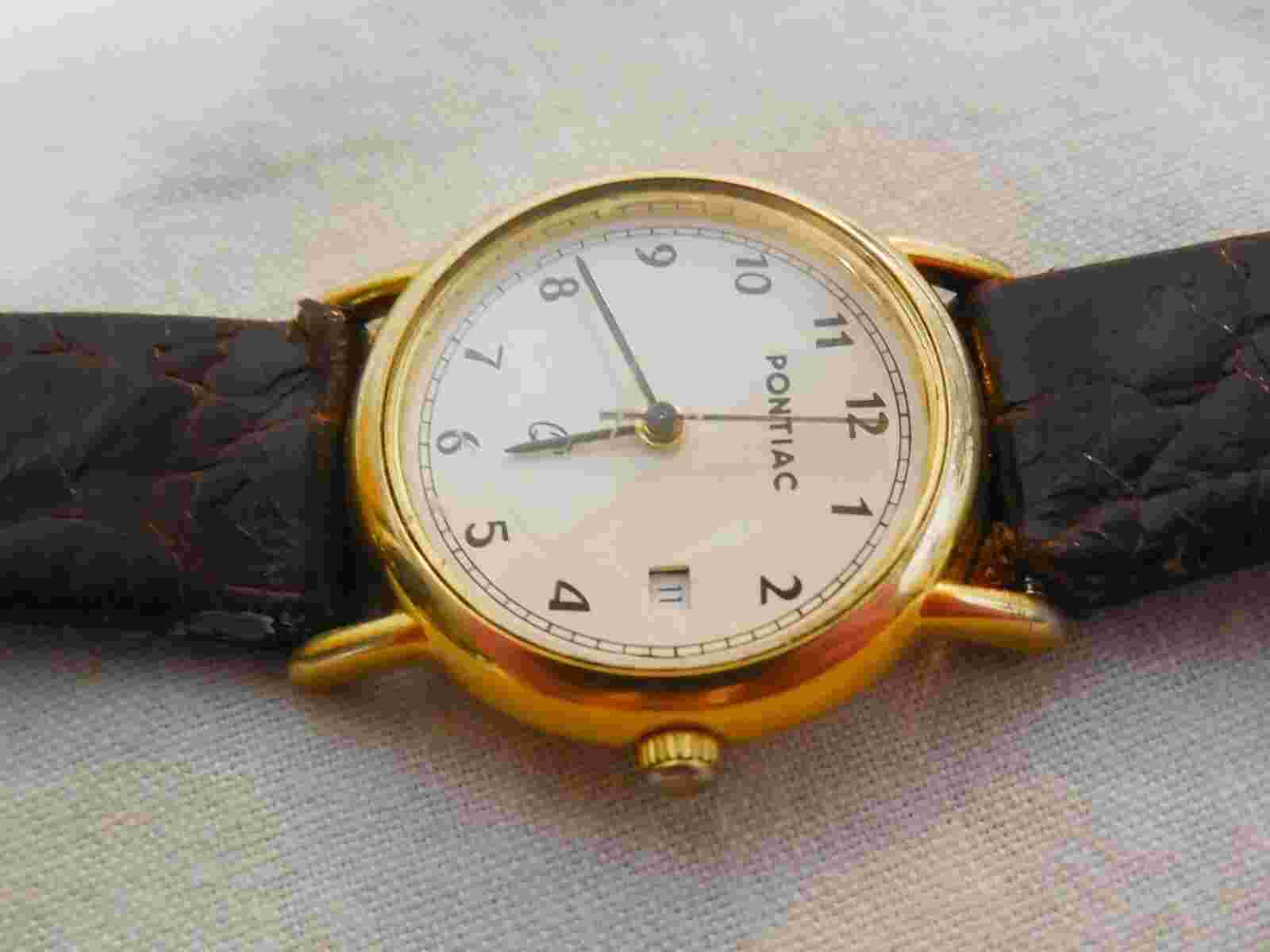 LADIES "PONTIAC" GOLD TONE with DAY CALANDER QUARTZ WRIST WATCH