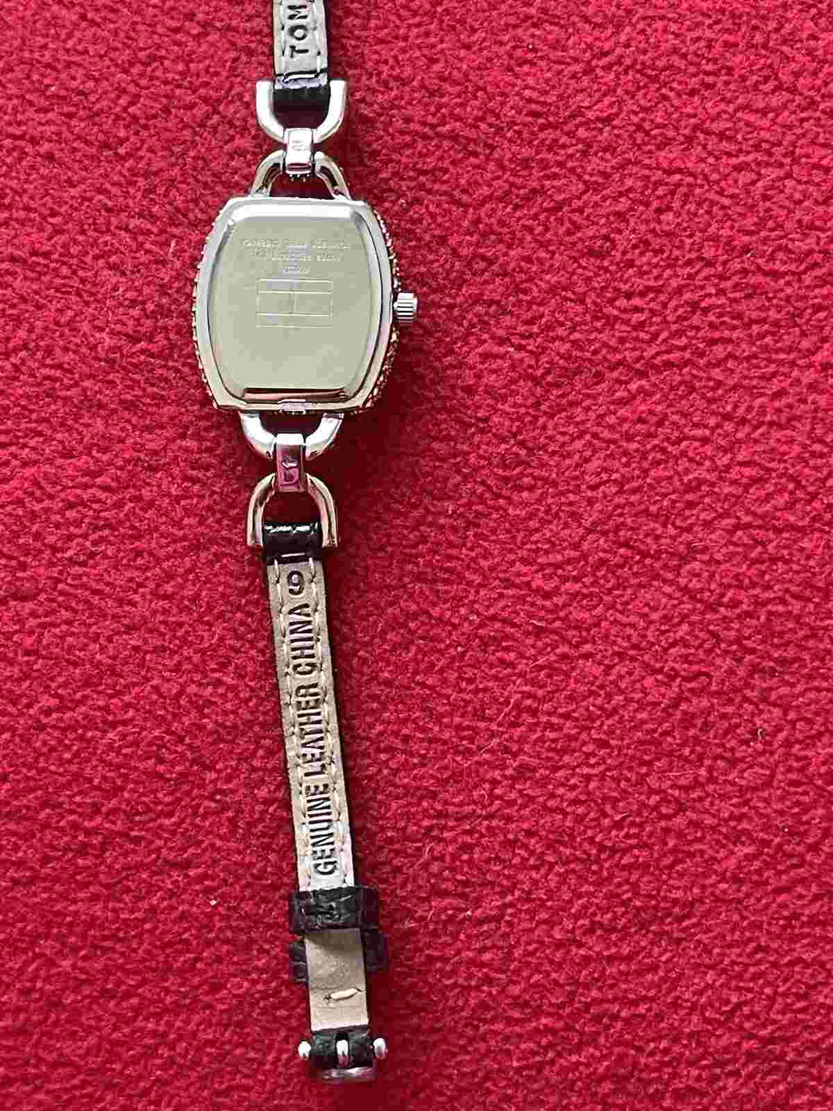 Tommy Hilfiger women leather watch with silver decorated dial case. $288