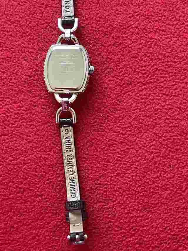 Tommy Hilfiger women leather watch with silver decorated dial case. $288