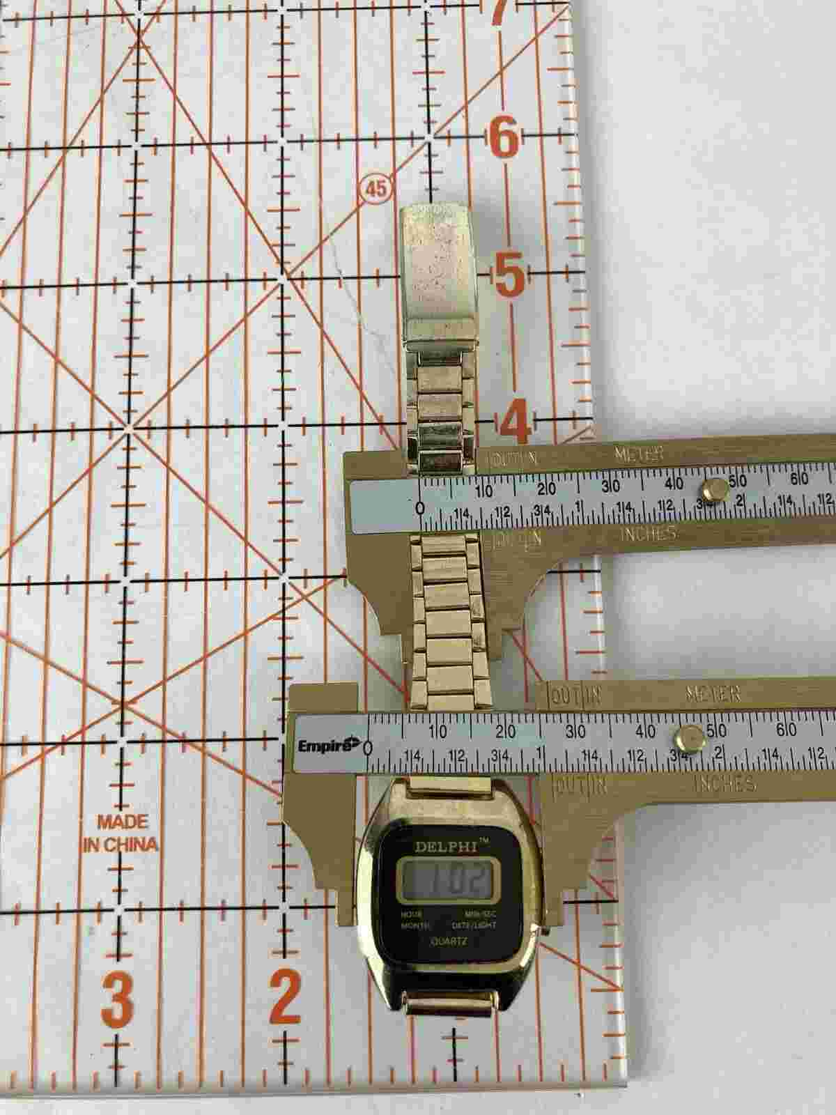 Vintage 1980’s Delphi 27mm Gold Tone Quartz Digital Watch w/Band & Battery
