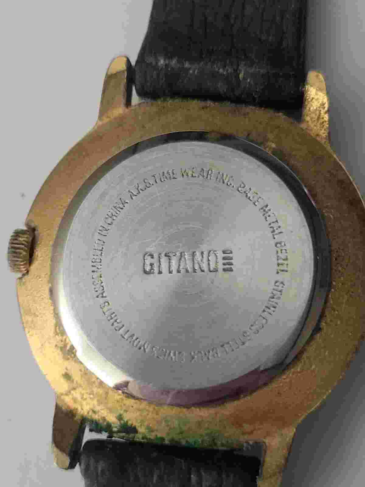 Gitano Quartz Watch. Needs Battery. Scratches. Swiss mvmt. Rust. Sold As Is.