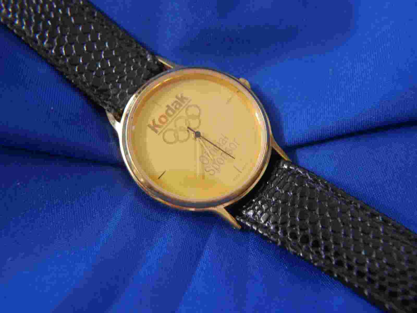 KODAK OFFICIAL SPONSOR BLACK LEATHER BAND GOLD TONE WATCH A15