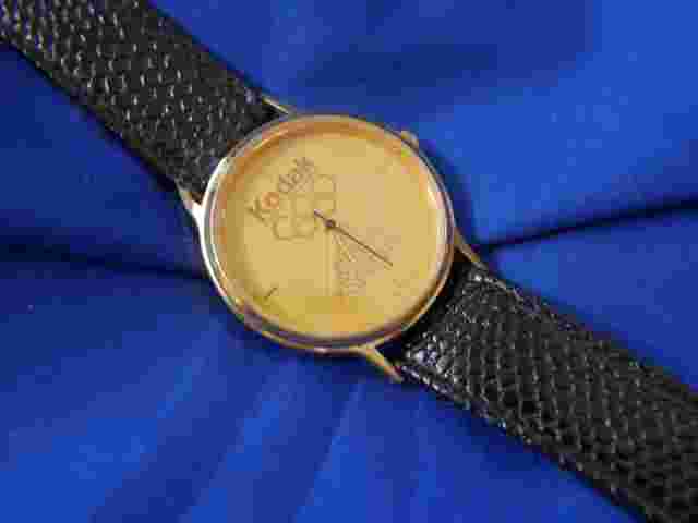 KODAK OFFICIAL SPONSOR BLACK LEATHER BAND GOLD TONE WATCH A15