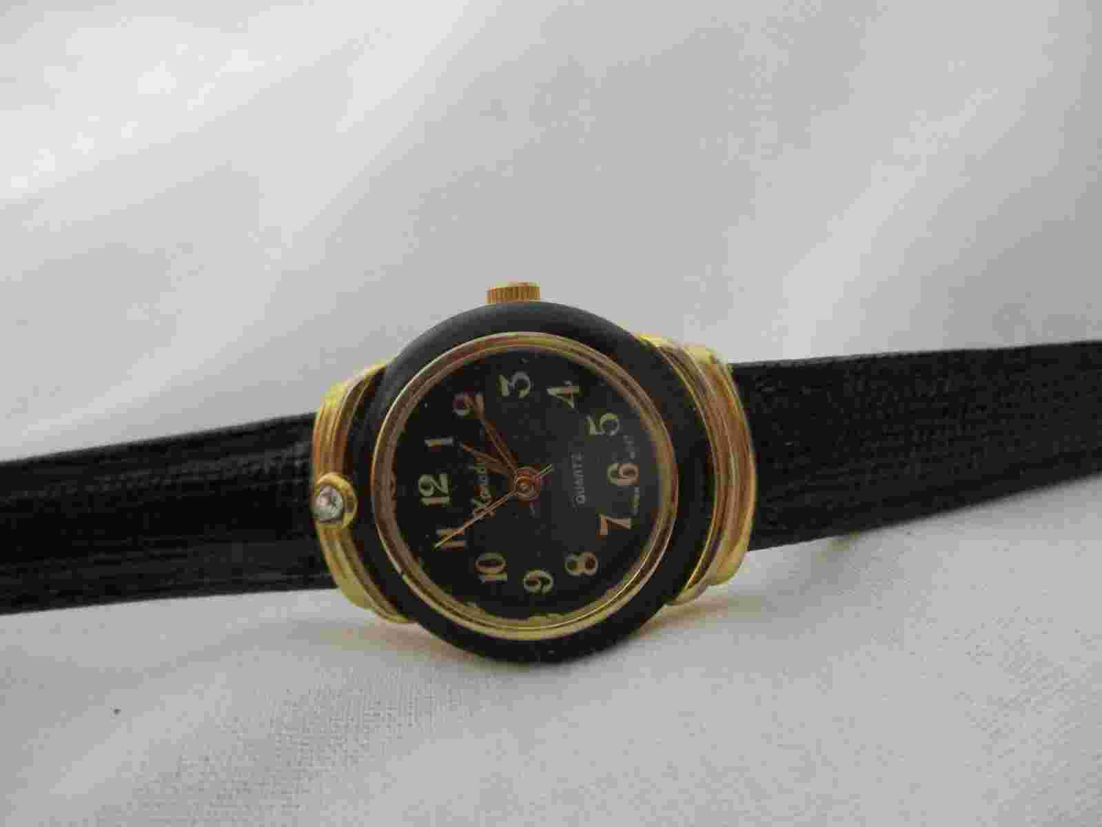 Xanadu Analog Wristwatch with Quartz Movement and a Buckle Band