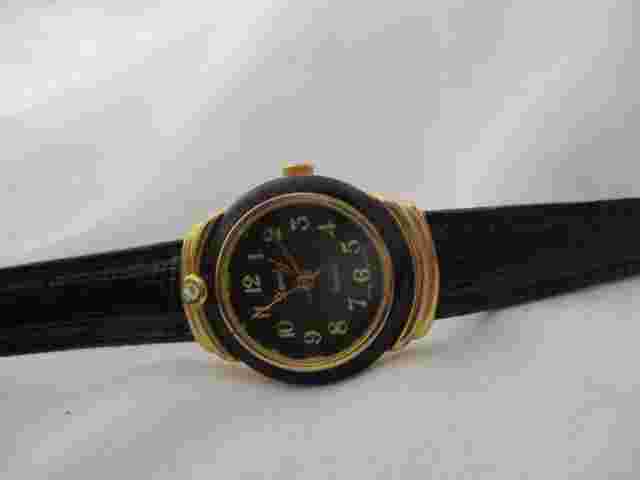 Xanadu Analog Wristwatch with Quartz Movement and a Buckle Band
