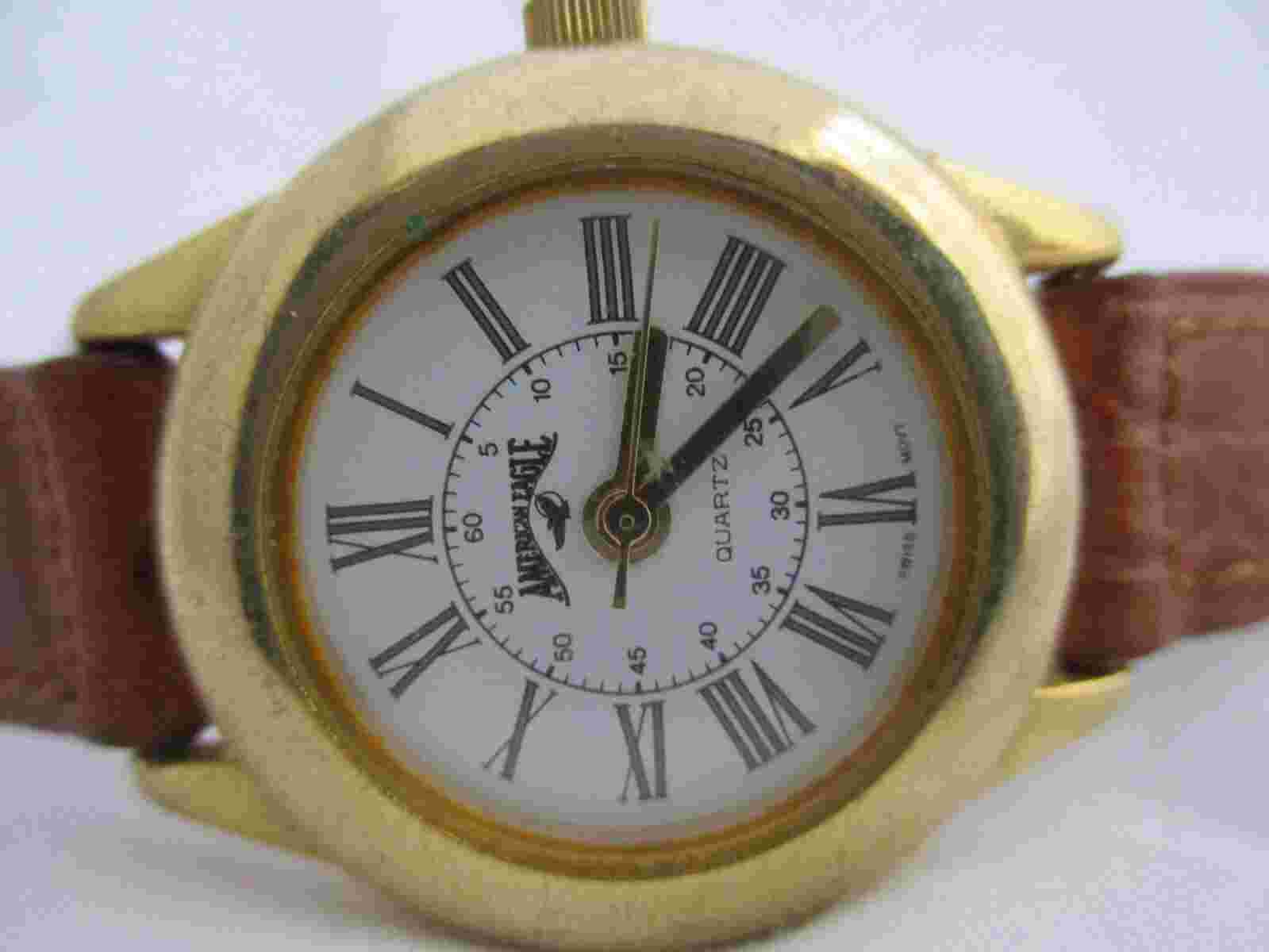American Eagle Wristwatch Woven Brown Buckle Band Gold Tone Roman Numerals